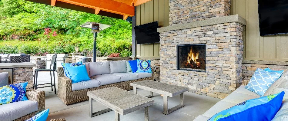 A patio on a property in Manheim, PA, with an outdoor fireplace.