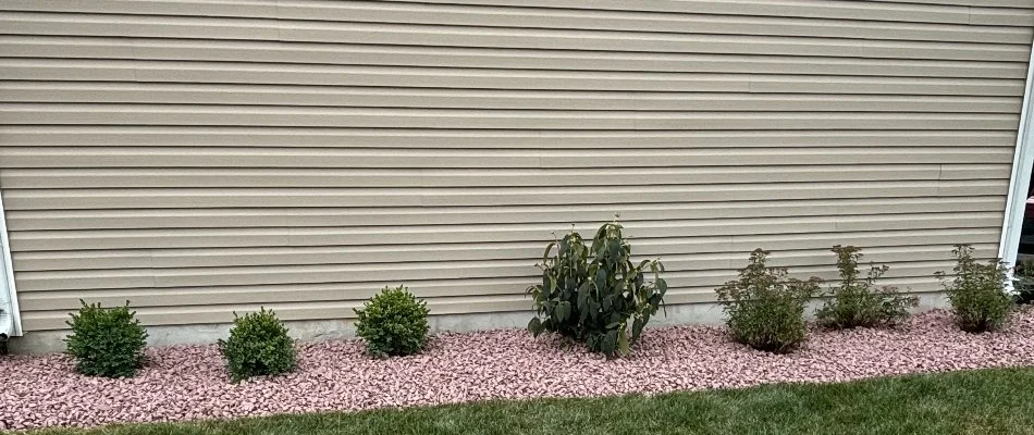 A rock landscape bed in Lititz, PA, along the side of a house.