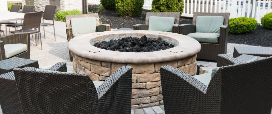 Round fire pit surrounded by chairs in Lititz, PA.