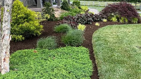 Ephrata, PA home landscaping with brown mulch.